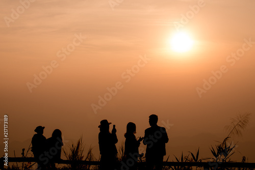 twilight sky and silhouette people