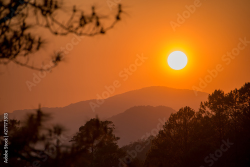 sunset and silhouette mountain forest 