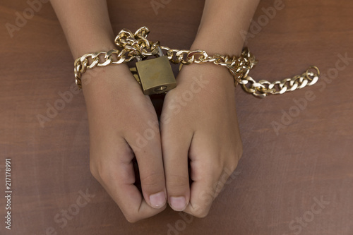  A fearful child. End to violence against child.Stop abusing violence. chain-bound child. do not hit the children.