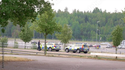 Police officers returning to theire cars photo