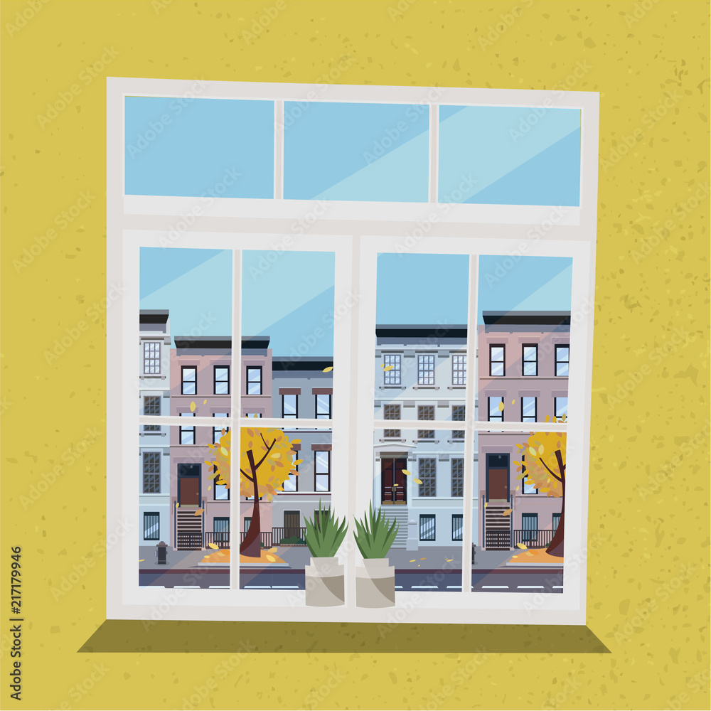 Φωτογραφία Window with view of houses on street with road in town and yellow trees, flying leaves