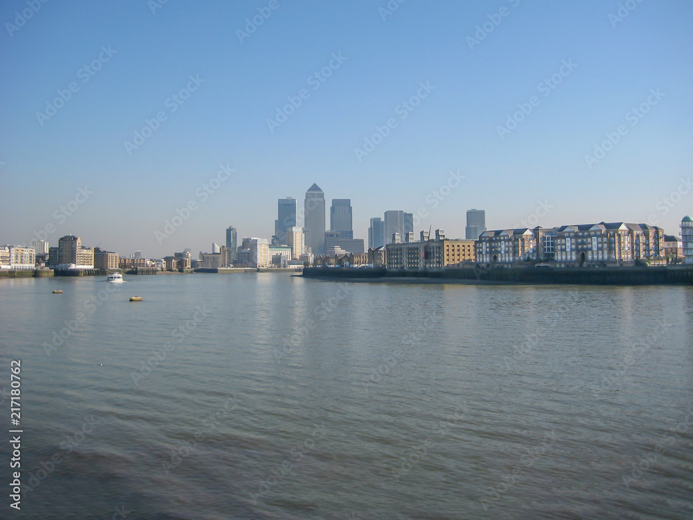 River Thames with Canary Wharf skyscrapers, in London, UK