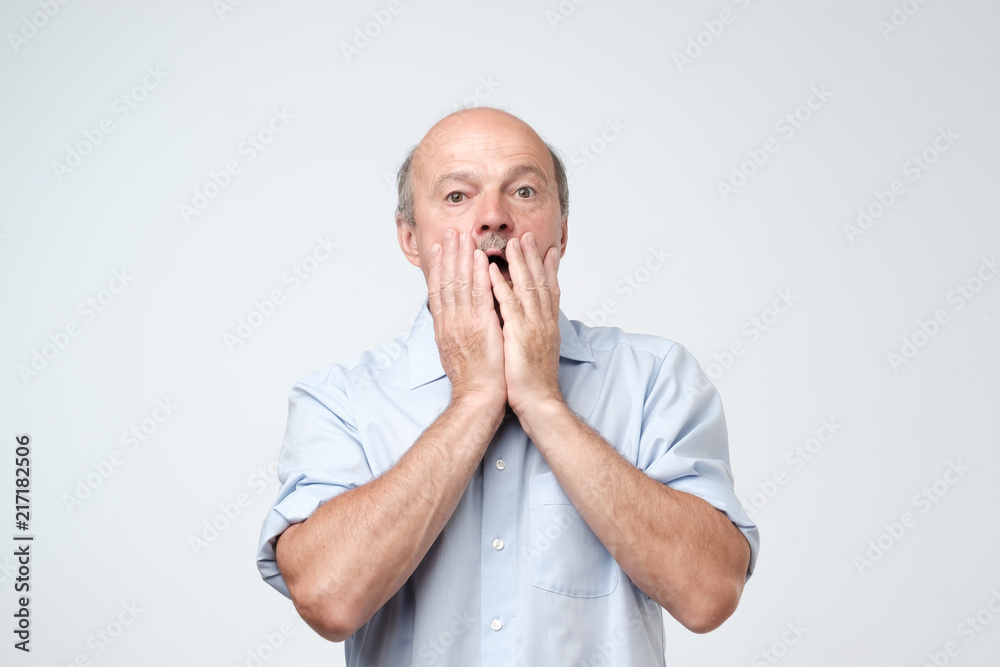 Shocked caucasian man face. Concept of shock and fear Shocked caucasian man face. Concept of shock and fear