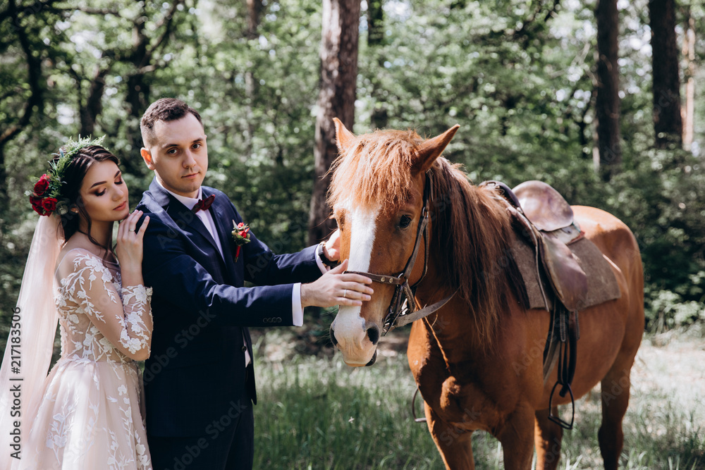 Forest walk of the newlyweds on horseback. Forest walk of the newlyweds on horseback.