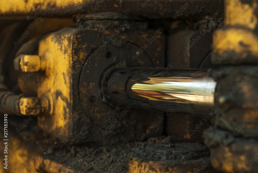 dirty oily fragment of the hydraulic drive of the steering gear of a quarry loader dirty oily fragment of the hydraulic drive of the steering gear of a quarry loader