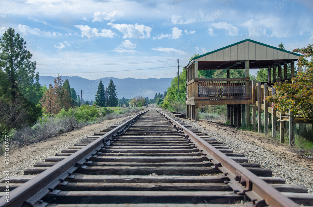 Rural Mountain Railroad Platform Waiting for Train and Passengers