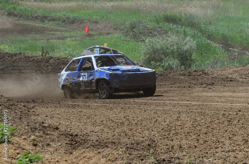 Race of the old wrecked cars. Rally on the open air with dust
