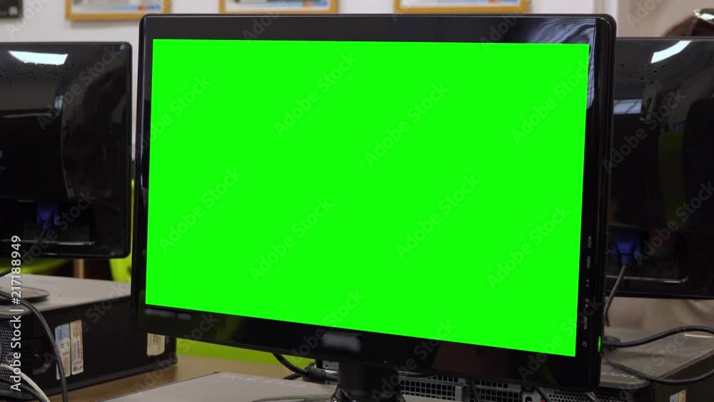 Closeup on a green computer screen in a high school classroom Closeup on a green computer screen in a high school classroom