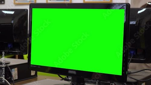 Closeup on a green computer screen in a high school classroom