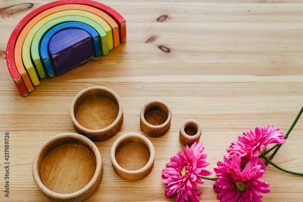 Group of learning materials of round and wooden colors on wooden table with space for text
