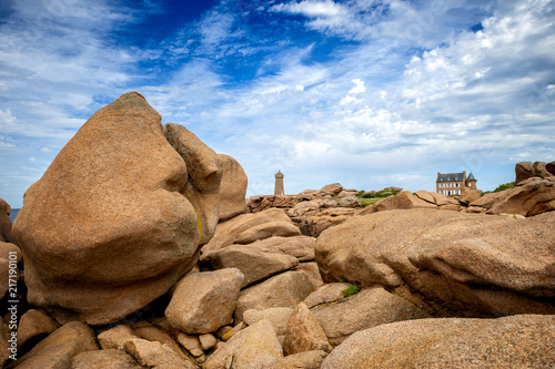 Ploumanac'h Mean Ruz lighthouse between the rocks in pink granite coast, Perros Guirec, Brittany, France. photo