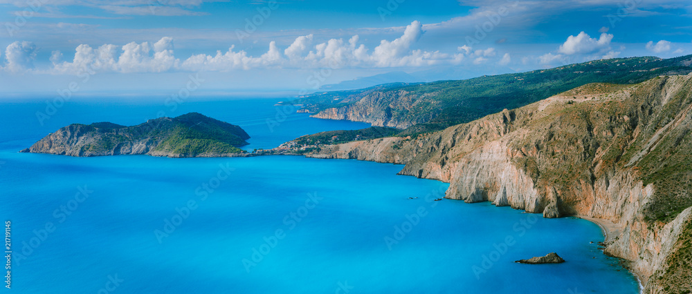 Stunning coastal panorama and beautiful clouds at the horizon on Kefalonia island. Mediterranean Sea summer coastal landscape