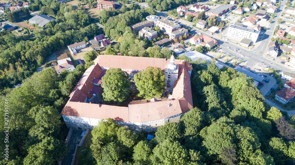 Aerial view of famous Herzberg Castle,  in sunny day light, Germany, Saxony