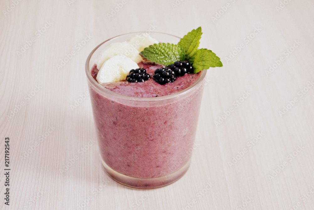 Banana and blackberry smoothie on the table Banana and blackberry smoothie on the table
