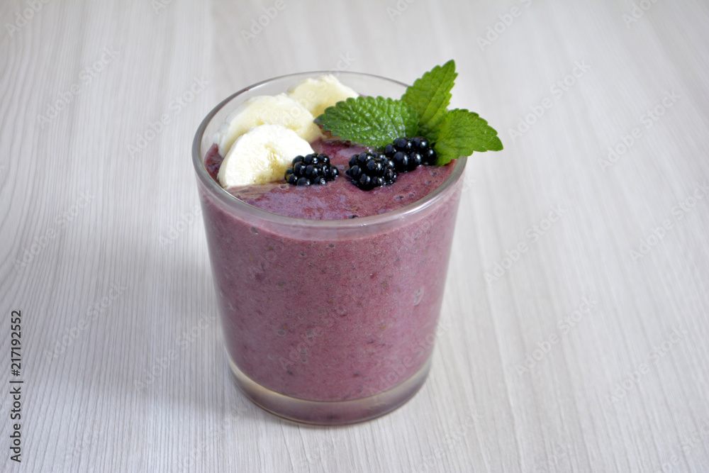Banana and blackberry smoothie on the table Banana and blackberry smoothie on the table