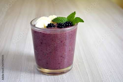 Banana and blackberry smoothie on the table