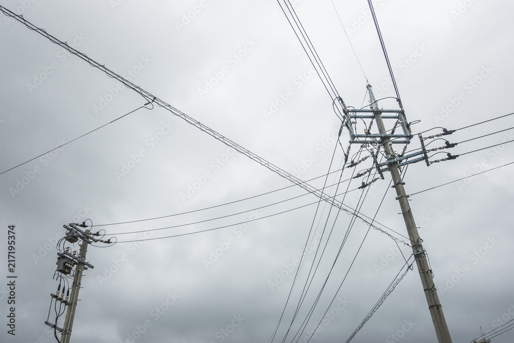 Power Supply with Pole in Thailand, Electricity Pole and Wires with the sky and cloudy backdrop, copy space Power Supply with Pole in Thailand, Electricity Pole and Wires with the sky and cloudy backdrop, copy space