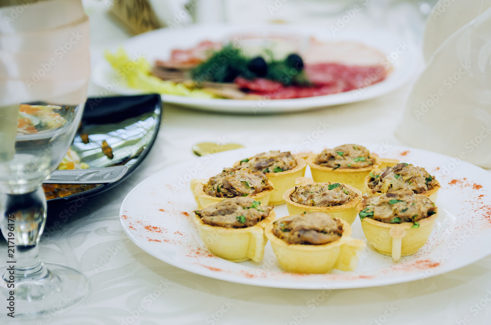 tartlets with meat pate. food on the table.