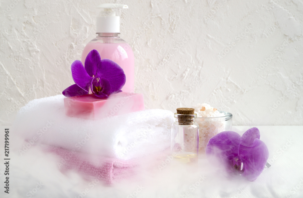 Liquid soap and two towels on a white background. Liquid soap and two towels on a white background.