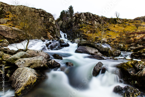 Waterfall through the welsh landscape and Ogwen Valley