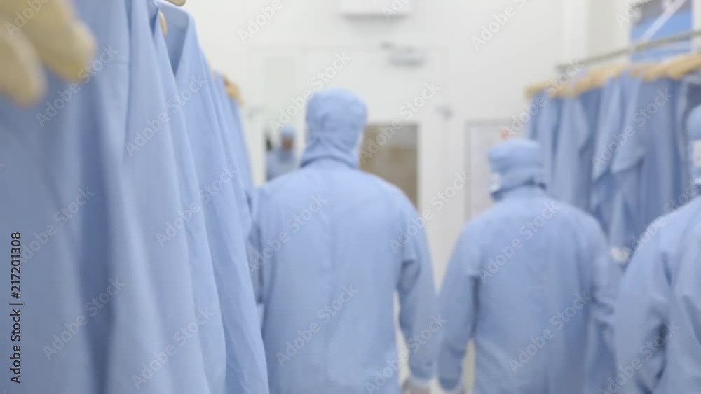 A Group Of Scientists Entering A Nanofabrication Cleanroom Facility A Group Of Scientists Entering A Nanofabrication Cleanroom Facility