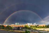 Double rainbow above the downtown skyline after a storm in Denver, Colorado