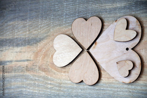 pattern of wooden hearts on a wooden background