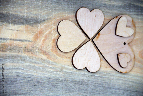 pattern of wooden hearts on a wooden background