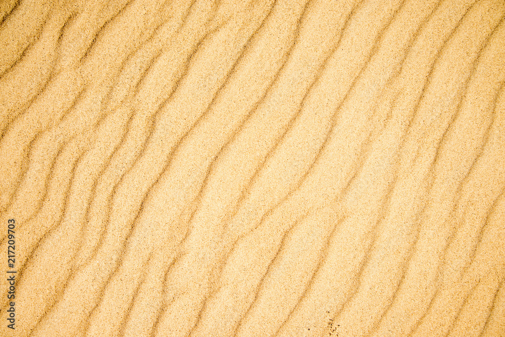 Sand of a beach with wave patterns Sand of a beach with wave patterns