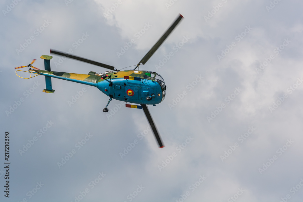 A Helicopter in a Spectacular Move at an Airshow A Helicopter in a Spectacular Move at an Airshow