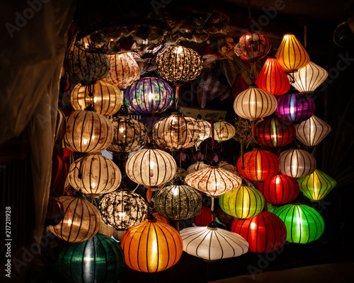 Asian lanterns illuminted in shop doorway