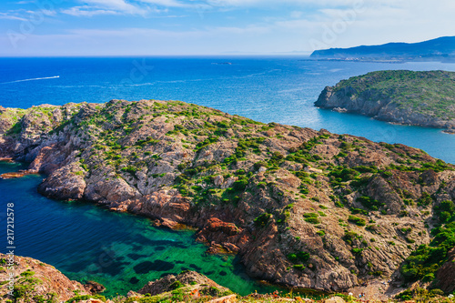 Sea landscape with Cap de Creus, natural park. Eastern point of Spain, Girona province, Catalonia. Famous tourist destination in Costa Brava. Sunny summer day with blue sky and clouds photo