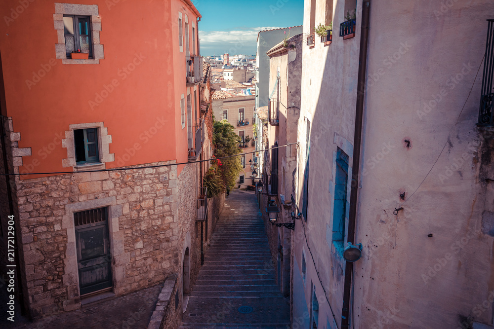 Street in Girona, Catalonia, Spain. Scenic and colorful ancient town. Famous tourist resort destination, perfect place for holiday and vacation.