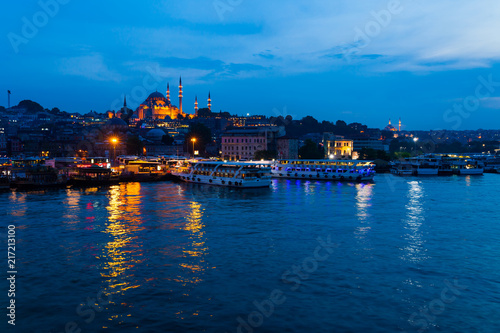 Night view of Istanbul. Panorama cityscape of famous tourist destination Golden Horn bay part of Bosphorus strait. Travel illuminated landscape Bosporus  Turkey  Europe and Asia.