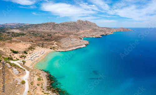 Aerial birds eye view drone photo Agia Agathi beach near Feraklos castle on Rhodes island, Dodecanese, Greece. Panorama with sand beach and clear blue water. Famous tourist destination in South Europe