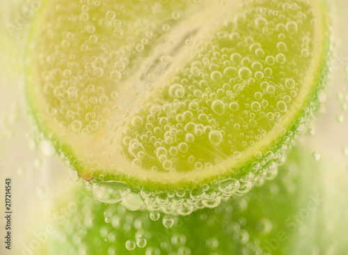 beautiful macro of lime and bubble water for a fresh cocktail