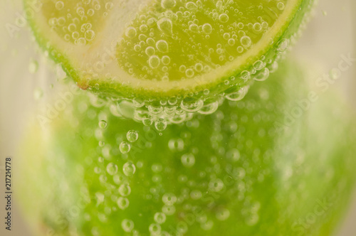 beautiful macro of lime and bubble water for a fresh cocktail