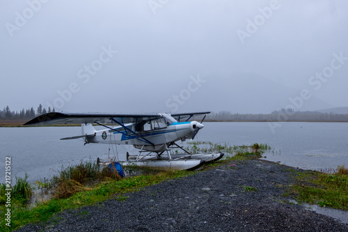 Hydroplane in the shoreline. Foggy day. Lake. Alaskan transportation.