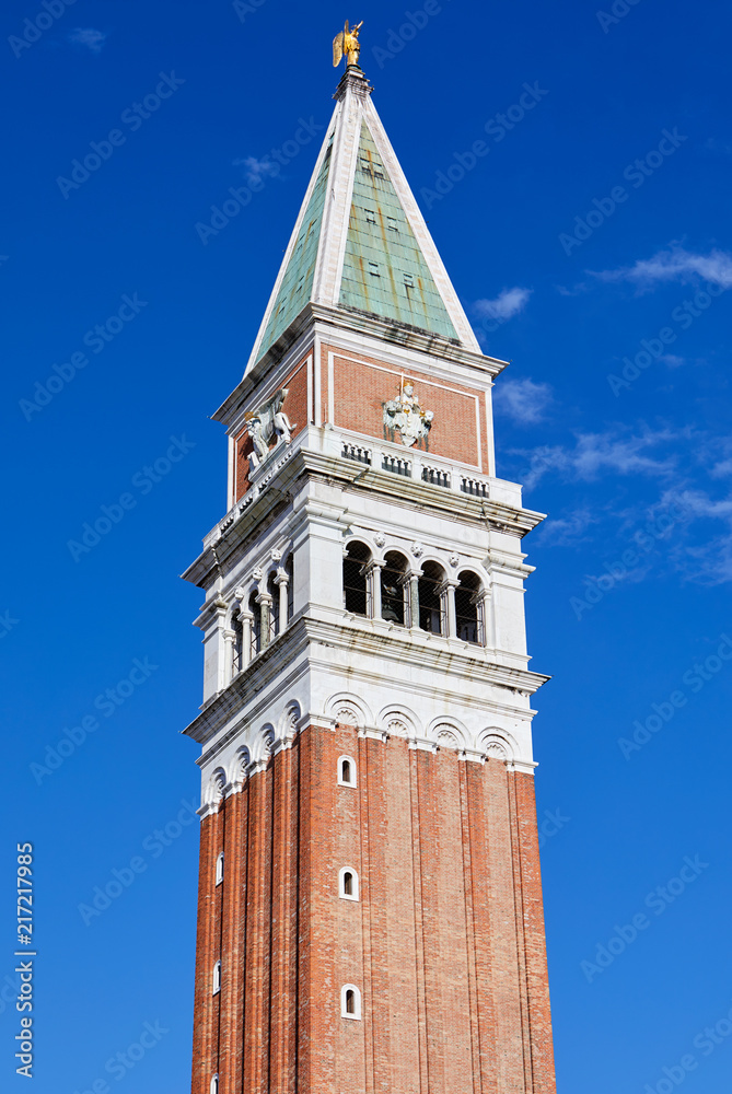 Saint Mark bell tower in Venice in a sunny summer day, blue sky