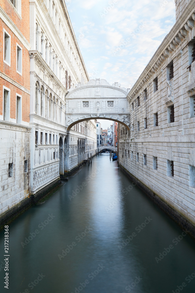 Bridge of Sighs and calm water in the canal, nobody in Venice, Italy