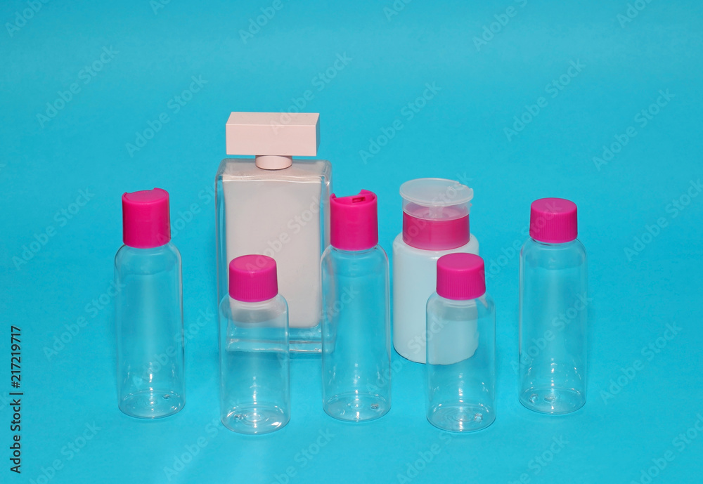 Glass bottles on blue background Glass bottles on blue background