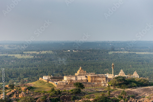 Shravanabelagola, Karnataka, India - November 1, 2013: Seen from Bhagwan Bahubali Jain Tirth. Chandragupta Basadi, Digambar Jain Mandir and Bhagwan Bharat temple complex on hill. Plains in back.