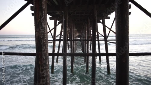 Wallpaper Mural Waves rolling into shore underneath a pier in San Diego. Torontodigital.ca