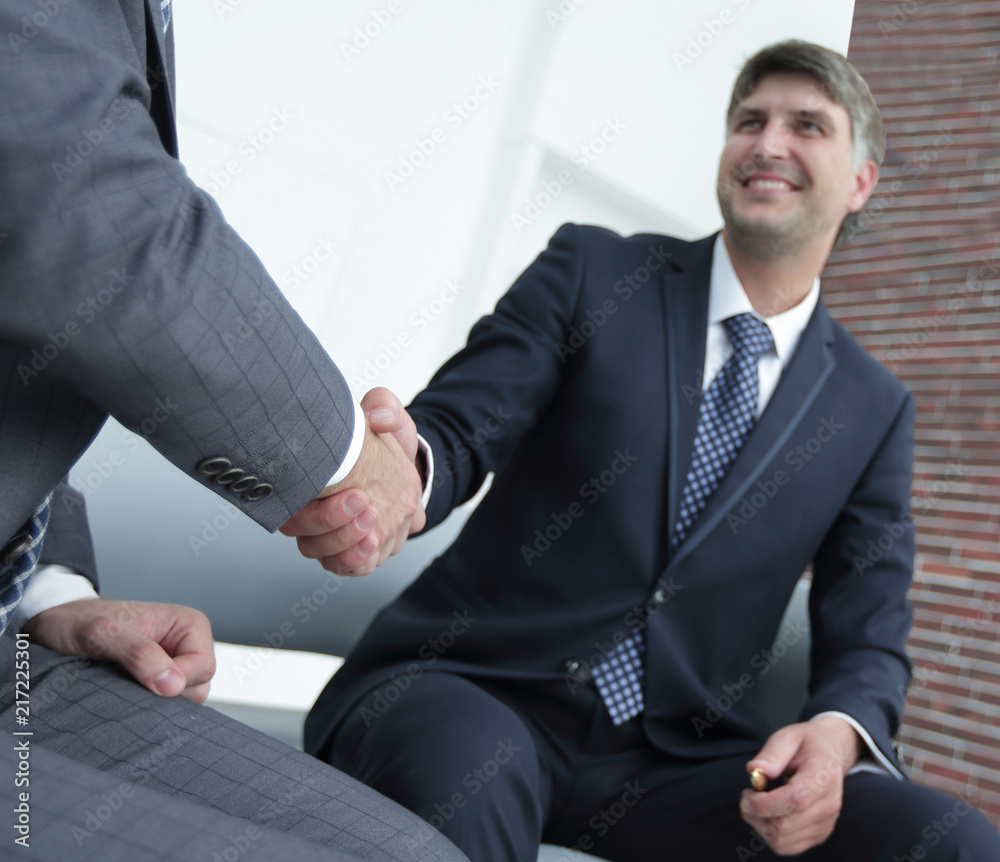 Handshake manager and attorney in the office