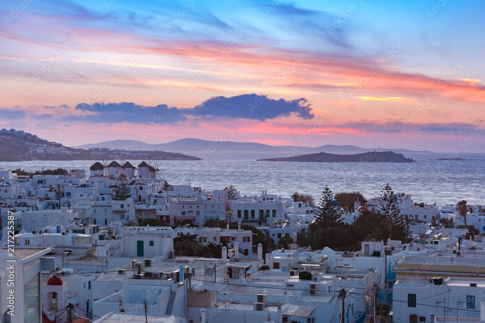 Famous view, Traditional windmills at sunset in Mykonos City, Chora, on the island Mykonos, The island of the winds, Greece