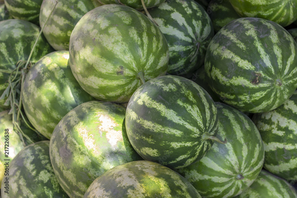 Close-up shot of green fresh watermelon at bazaar Close-up shot of green fresh watermelon at bazaar