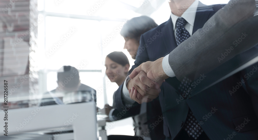 handshake of business partners in conference room handshake of business partners in conference room