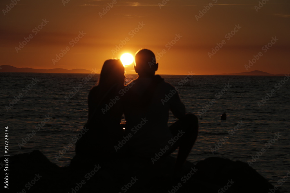 Romantic couple - sunset by the sea