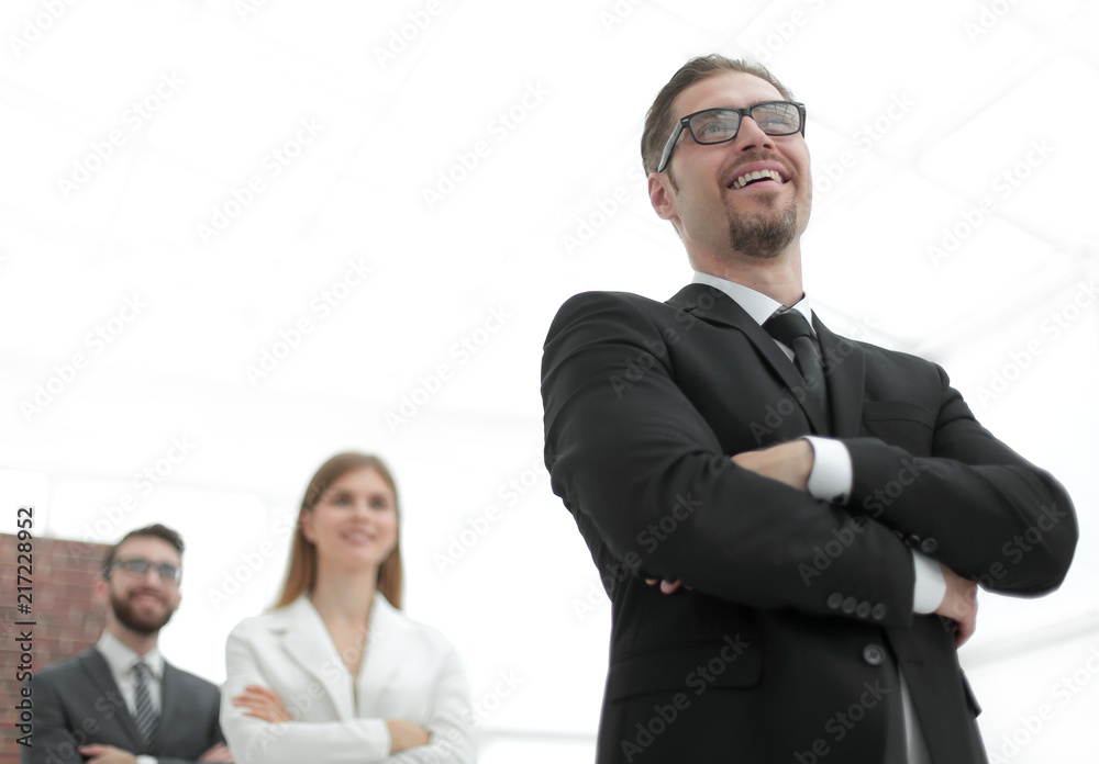 project Manager standing in front of his business team project Manager standing in front of his business team