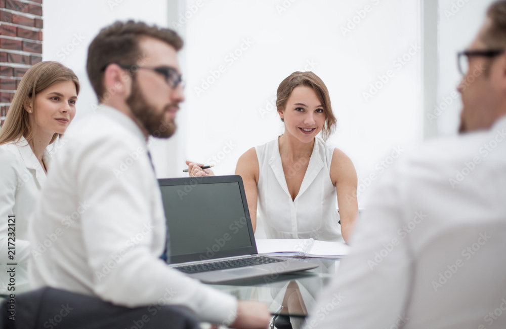 rear view.business colleagues sitting at the Desk rear view.business colleagues sitting at the Desk